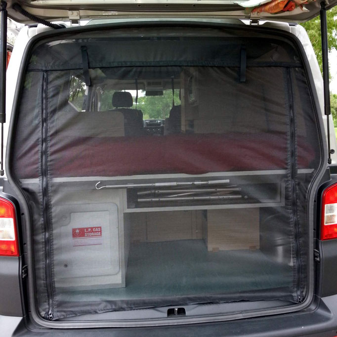 elevated bed in rear, with gas storage compartment 