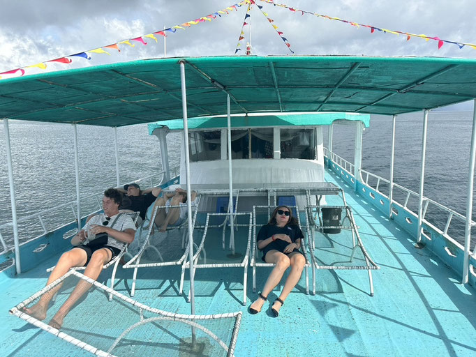 3 Scuba Divers having a rest on Phu Quoc Scuba Diving Boat | Rainbow Divers Vietnam PADI Dive Center Phu Quoc