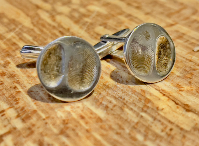 Silver cufflinks with children's finger prints