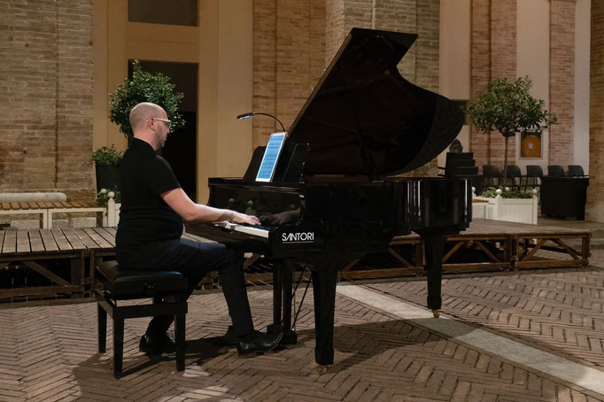 In performance at the Cortile Raffaello in Urbino, Italy