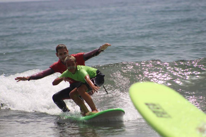 Instructor, student tandem surfing - wohoo