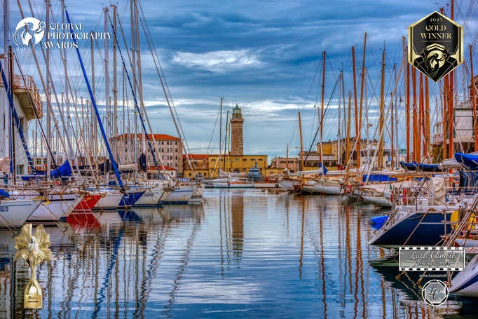 Global Photography Awards 2025 ~ Gold Winner. Luci Di Trieste. Vecchia Lanterna, Trieste. © Luca Cameli Photographer