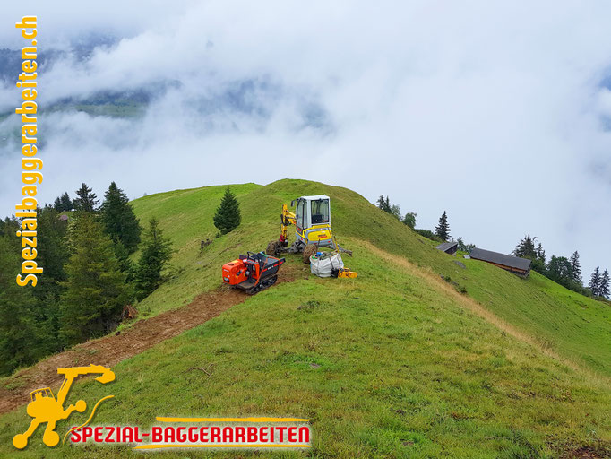 Spezialbaggerarbeit Adrian Krieg  Telefon 079 586 32 47 Gebirgsbau Bergbau alpiner Bau Hangsicherung Felsabbau Seilbahnfundamentbau Schneekanonenfundament Mastfundament Strasse Weg