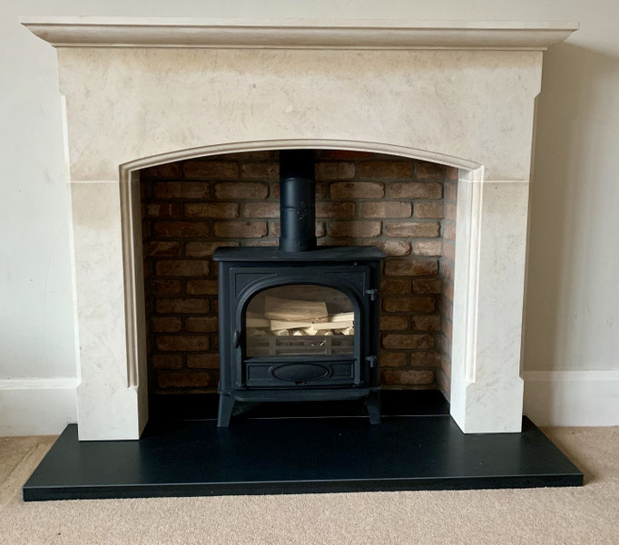 Fireplace chamber in Retro Barn Stock Brick with Ancaster Limestone surround