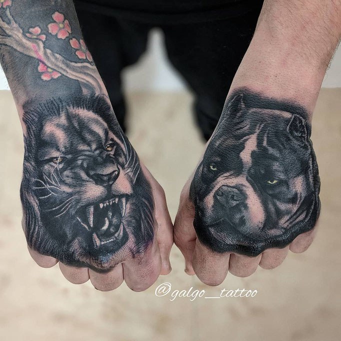 Hand tattoos of a tiger and a bulldog. Realistic tattoo artwork done in Spain.