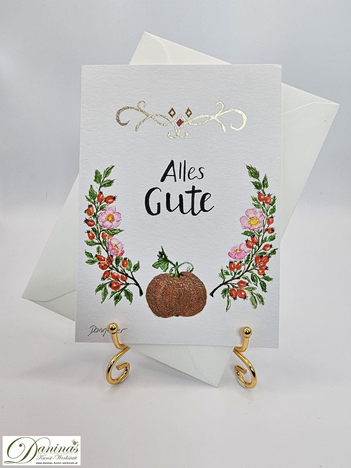 Geburtstagsgrußkarte Herbstmotiv mit Kürbis, Wildrosenzweigen und "Alles Gute"-Handlettering