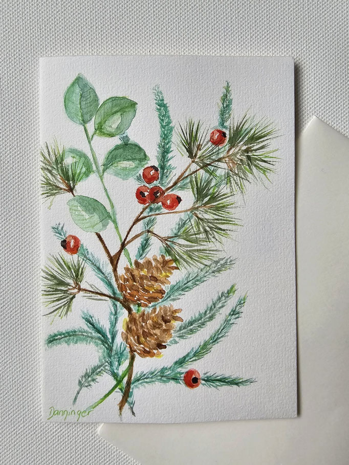 Weihnachtsgrußkarte gemalt Aquarell Winterzweige mit Zapfen und roter "Frohe Weihnachten"-Stempeldruck auf Innenseite