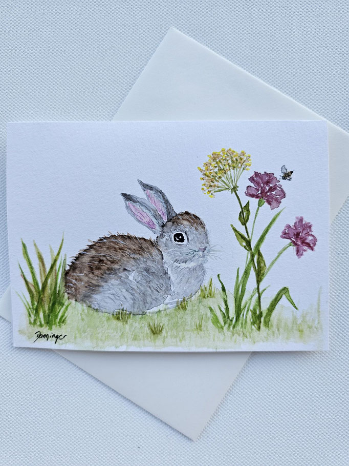 Ostergrußkarte Aquarell Hase mit Wildblumen und Biene