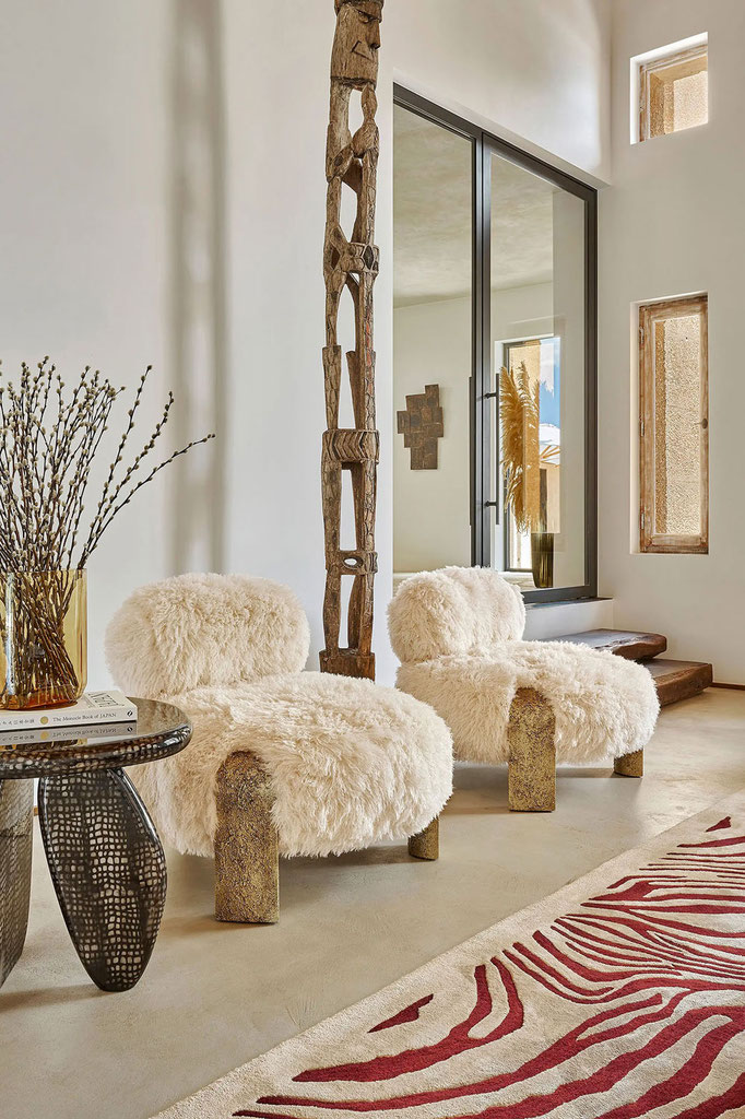Toulou armchairs designed by Luca Tornaghi for Roberto Cavalli Home, low armchairs with textured shearling upholstery and block legs