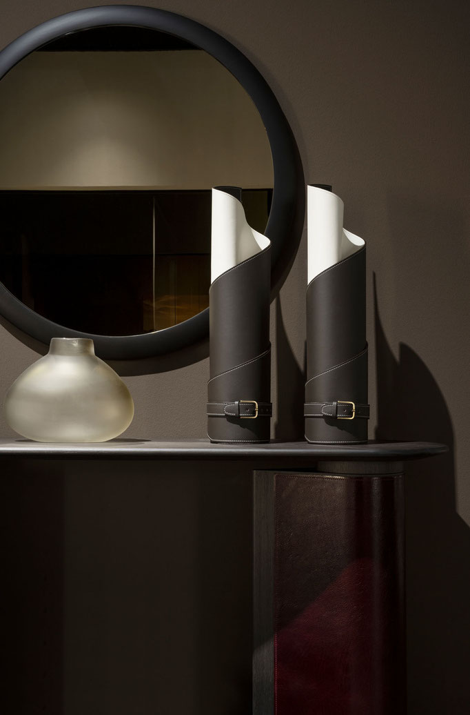Coira vase by Luca Tornaghi for Gianfranco Ferré Home, sculptural vase formed from a single sheet of double-face leather rolled onto itself with contrasting inner surface, visible stitching and signature belt closure with metal buckle
