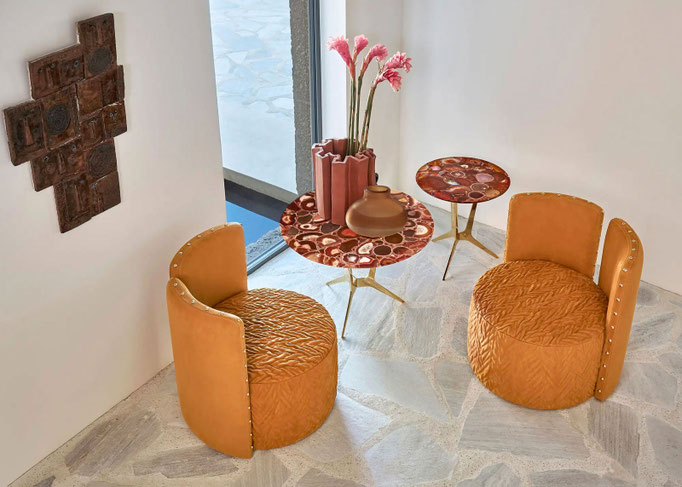 Manda armchairs designed by Luca Tornaghi for Roberto Cavalli Home, upholstered armchairs with cylindrical volume and stitched leather surface