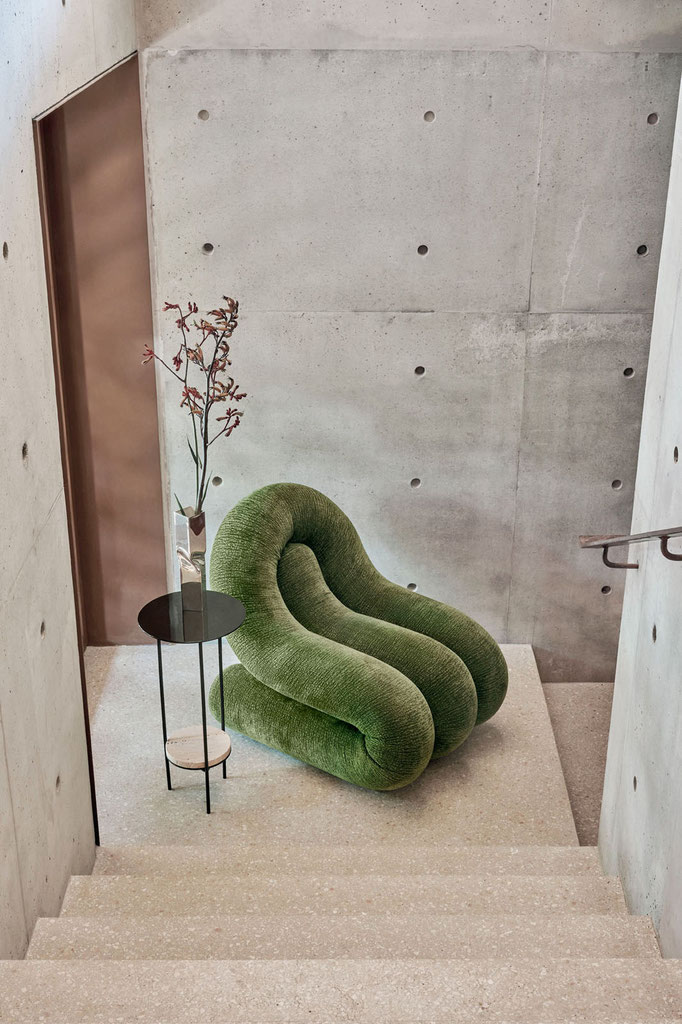 Brigge armchair designed by Luca Tornaghi for Gianfranco Ferré Home, sculptural upholstered armchair with enveloping curved backrest