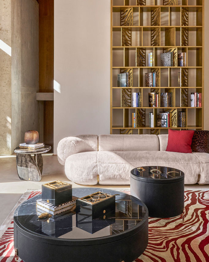 Toulou Sofa designed by Luca Tornaghi for Roberto Cavalli Home, where compact fur upholstery meets luminous structural accents.