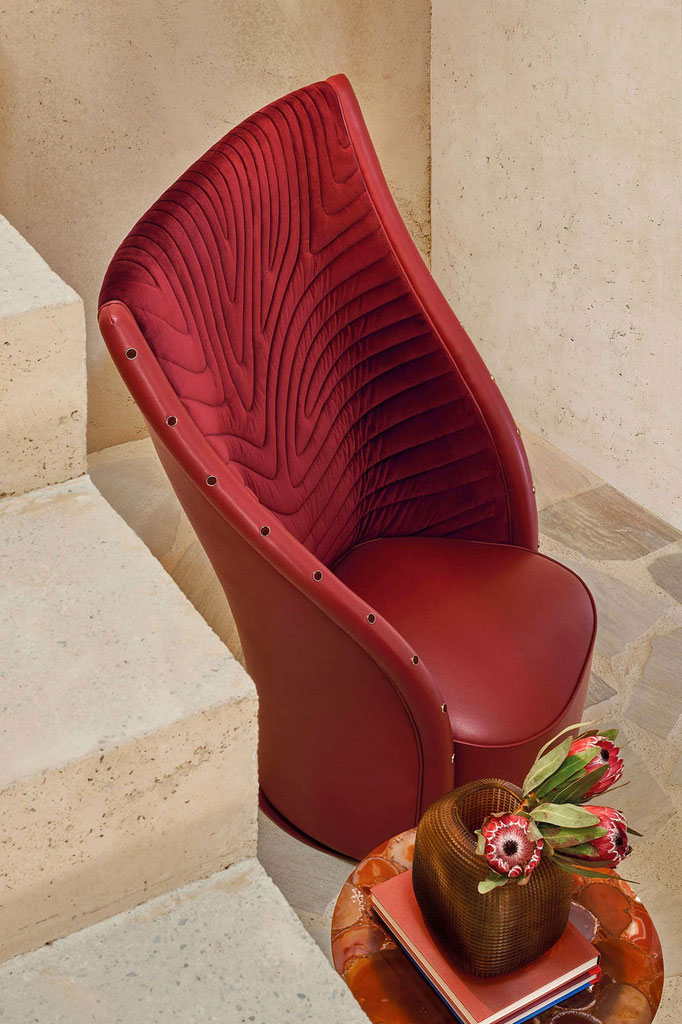 Nevada armchair designed by Luca Tornaghi for Roberto Cavalli Home, upholstered armchair with sculpted backrest and radial stitching pattern