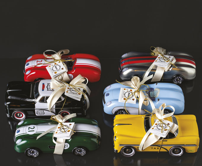 Assorted biscuits in decorative Vintage Car Collection metal tins
