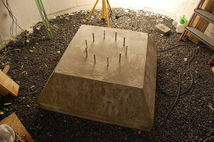 With the formwork removed, a truncated pyramid concrete footing is revealed.