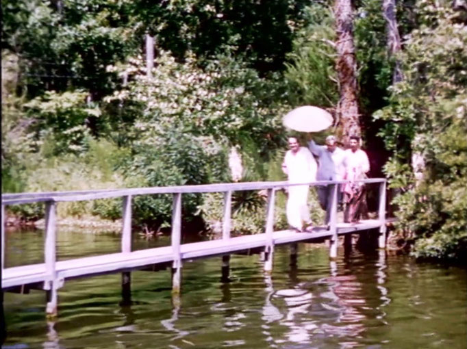 1956 ; Meher Center, Myrtle Beach, SC. ; Meher Baba walking across the Center's bridge. The images were captured by Anthony Zois from a film by Sufism Reoriented.