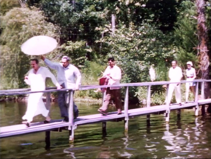 1956 ; Meher Center, Myrtle Beach, SC. ; Meher Baba walking across the Center's bridge. The images were captured by Anthony Zois from a film by Sufism Reoriented.