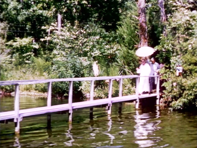 1956 ; Meher Center, Myrtle Beach, SC. ; Meher Baba walking across the Center's bridge. The images were captured by Anthony Zois from a film by Sufism Reoriented.