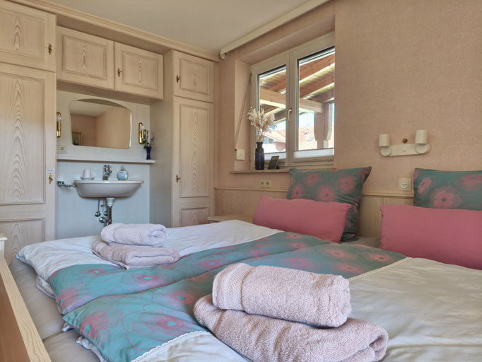 The washbasin is a handy feature in the bedroom.