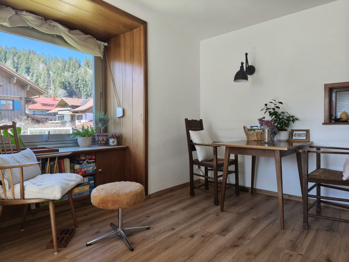 Dining / work area and reading chair in the living room.