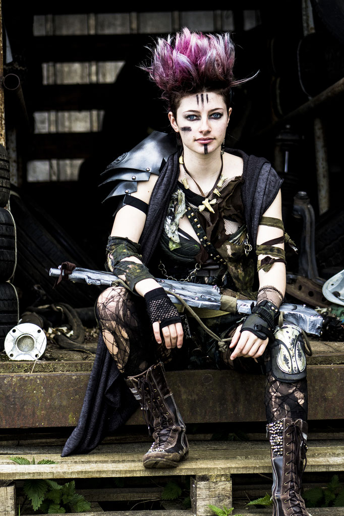 Heavily distressed post-apocalyptic costume and prop made with recycled materials.