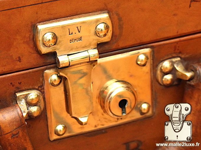 serrure poussoir valise Louis Vuitton cuir de vachette
