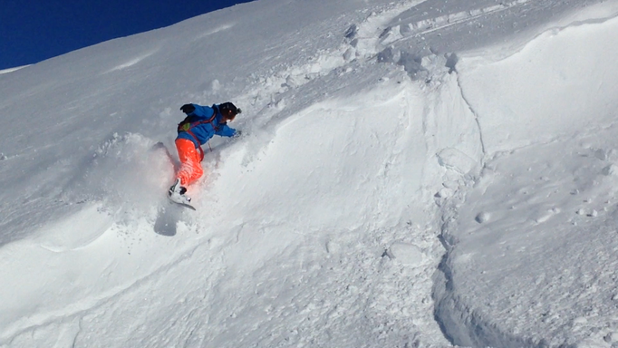 jump over a ridge on snowboard 