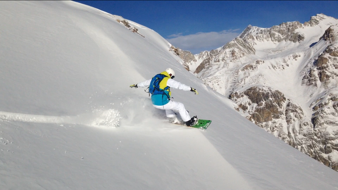 Snowboarding next to the slope