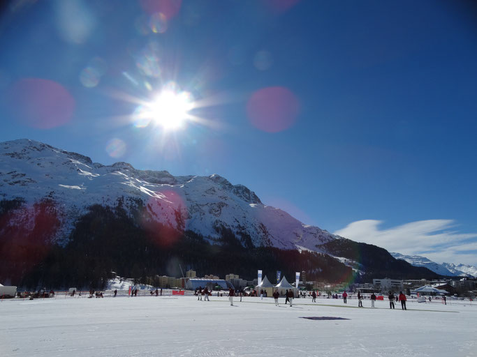 A photo across the lake of the cricket field at COI 2019