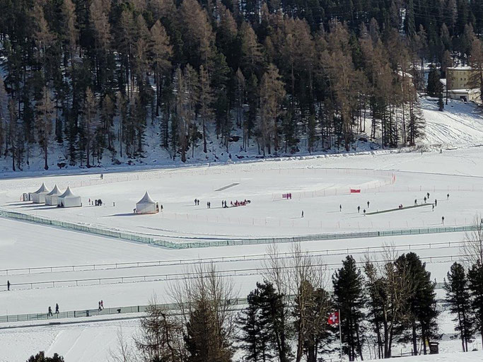 A view down onto the lake & Cricket on Ice from St Moritz Dorf