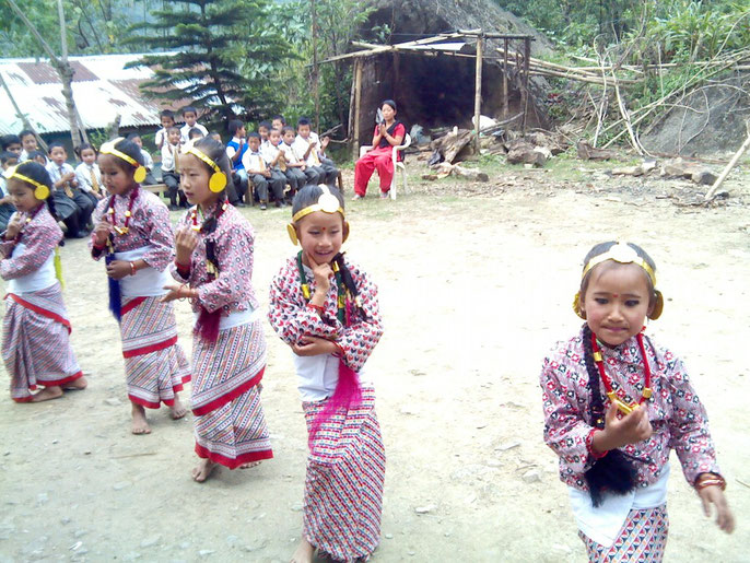 Children dancing at a farewell celebration for one of the volunteer teachers