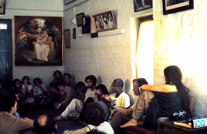 January 1975 - Mandali Hall, Meherazad - John ( wearing headphones ) is next to Eruch recording him & Sher DiMaggio Zois sitting on chair. Photo by Anthony Zois