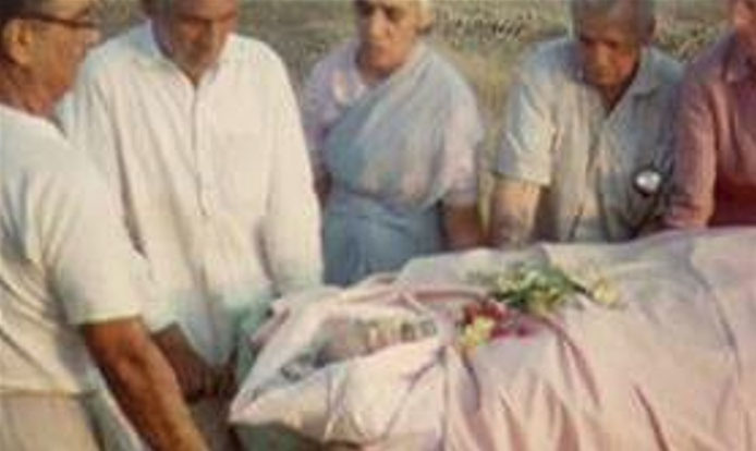 Meher Baba being carried by some of his close ones.