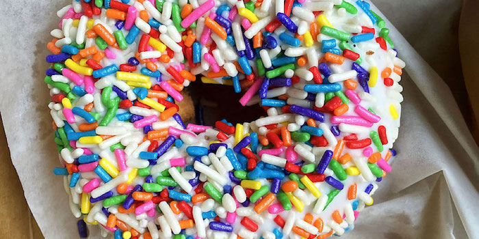 vegan rainbow sprinkle doughnut from voodoo doughnut in portland oregon