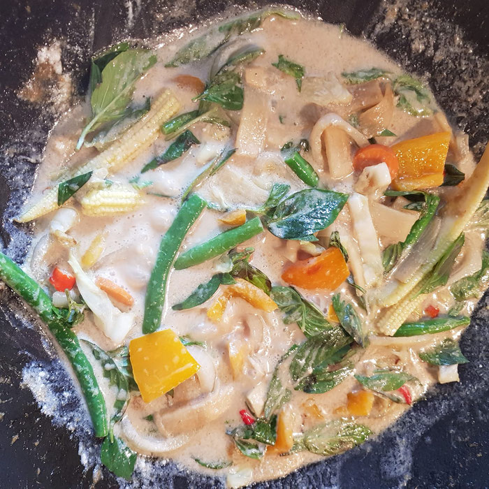 Green Thai curry with coconutmilk in the making