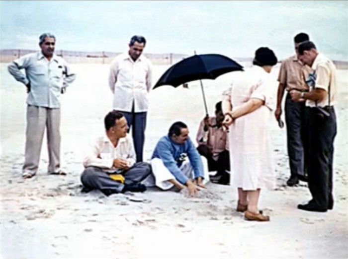 1956 ; Meherjee is standing behind Baba at the Center's beach, Myrtle Beach, SC.