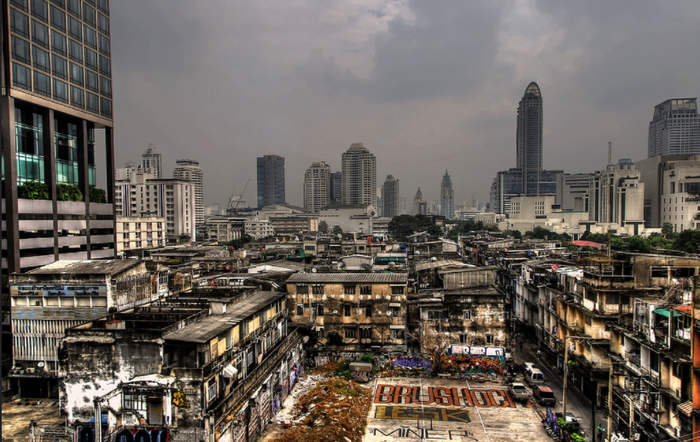 A view of the slums and the skyscrapers in the city of Bangkok. (Bangkok Skyline, Kavin Chawla, Flickr, 2012)