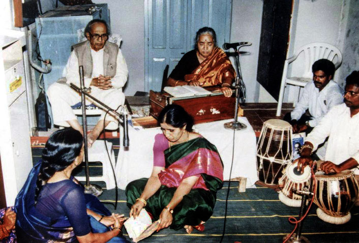 Photo courtesy of Nan Wicker. Madhusudan is accompanied by his wife Subhuddra on harmonium 