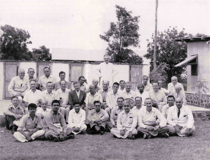 1954 - Upper Meherabad, India. Meher Baba with both his Eastern & Western followers. Adi is seated on the 2nd row, far right. LM p. 4500