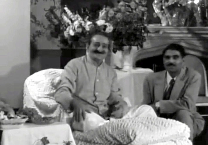 Meher Baba and Eruch Jessawala greeting visitors