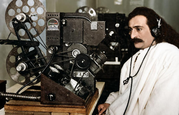 1932 : Meher Baba at the Paramount Film Studio in London, listening to his recording that they made at the Davy's home. Image rendition by Anthony Zois.
