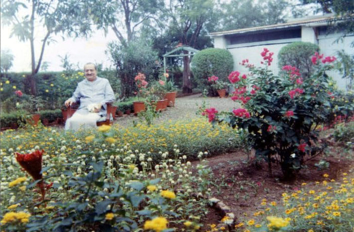Baba in the garden. Photo taken by Mehera.