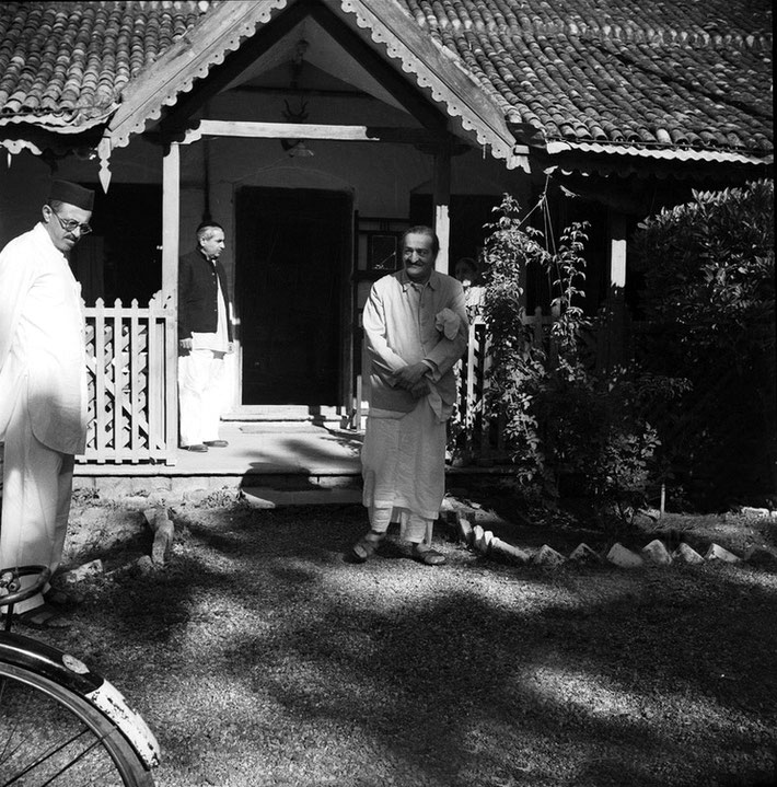 1960s - Khushru Quarters, Ahmednagar. Baba looking at Feram with Adi K. behinds them.