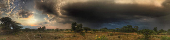 Photo by Andrew Radford, capturing a storm cloud rolling into Meherabad