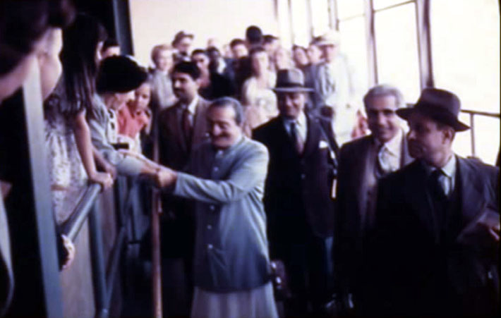 San Francisco Airport ; Baba possibly holding Kitty Davy's hands whilst walking to the plane along with the men mandali that will take onto Hawaii, then Australia and finally returning to Bombay, India.