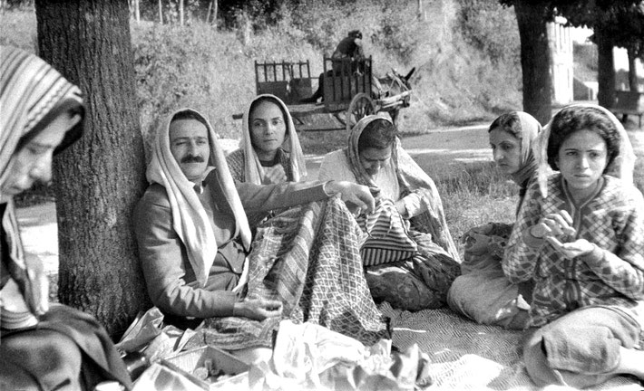 19th Sept.1937 : Having lunch on the road to Paris. Full image. ( L-R ) Kitty Davy, Meher Baba, Mehera Irani, Naja Irani, Khorshed Irani & Baba's sister Mani Irani. Photo taken by Elizabeth Patterson.