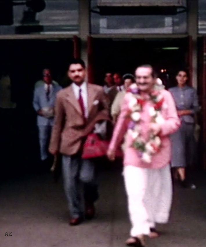 20th July, 1956 : Meher Baba outside the airport terminal with Eruch Jessawala. Image captured by Anthony Zois from a film by Sufism Reoriented.