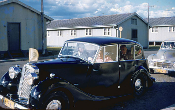 1956 : Meher Baba leaving Mascot Airport, Sydney on his way to stay at Meher House. Bill Le Page is driving, Francis Brabazon & the men mandali in the back seat. John Grant is driving the Morris with the luggage.