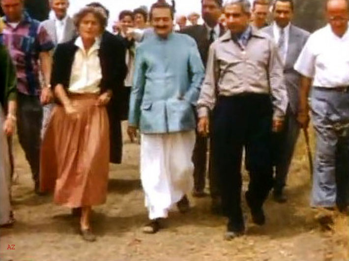 1956 ; Meher Baba being shown the Meher Mount property with caretaker Agnes Baron on the left and Adi K. Irani on Baba's right. Image captured by Anthony Zois from a film by Sufism Reoriented.